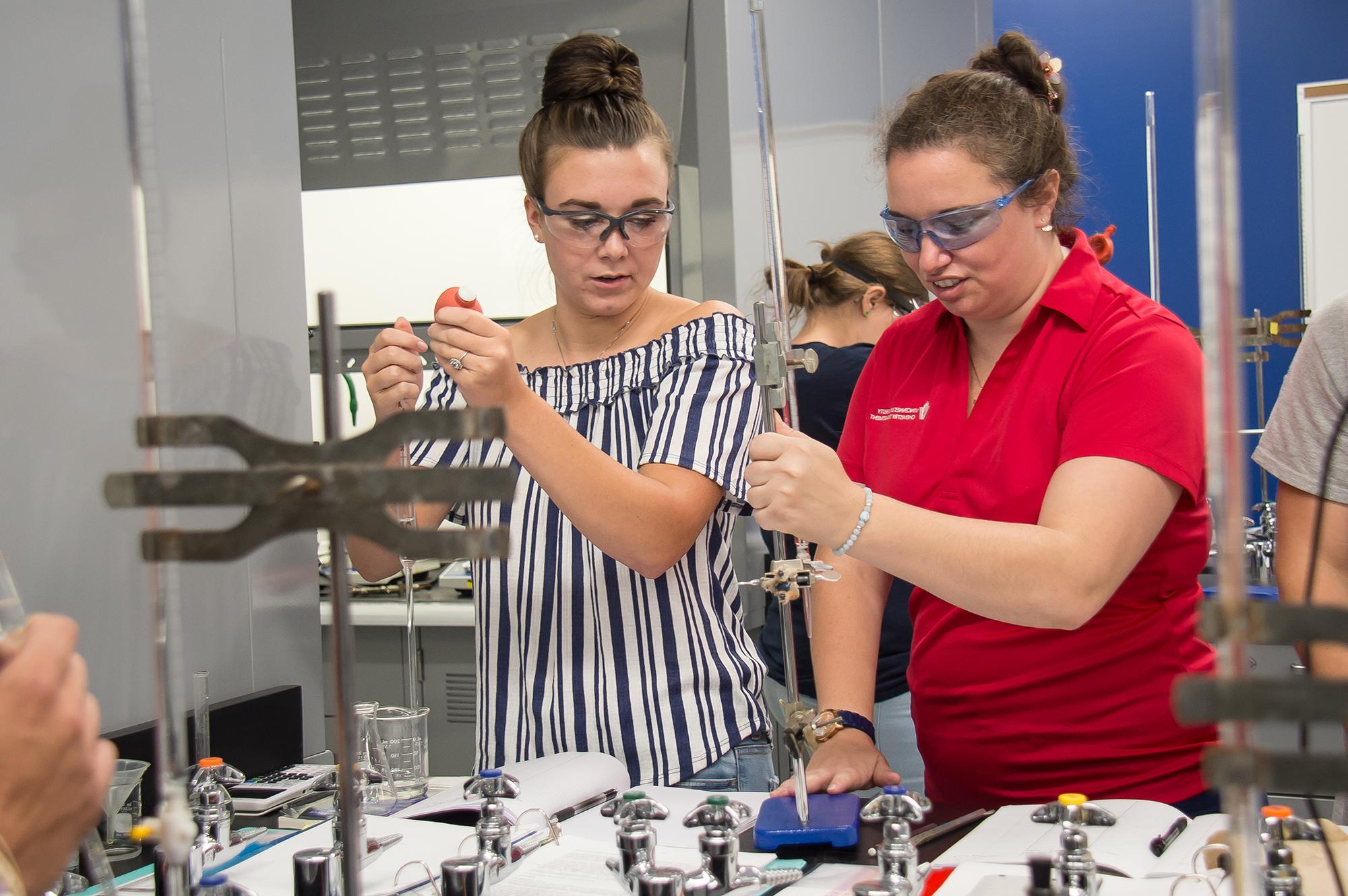 Chemistry students participating in a lab assignment